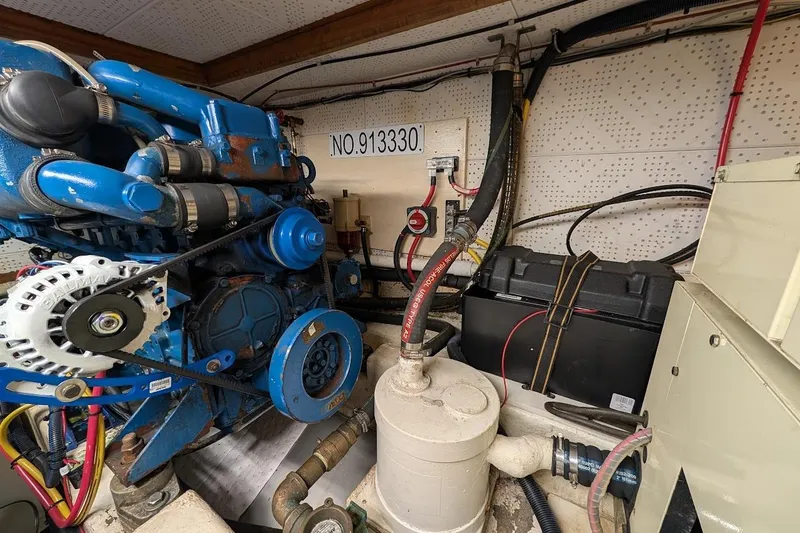 Slide: The Image of Engine room of a 1987 DeFever Trawler with visible machinery and components. - 44