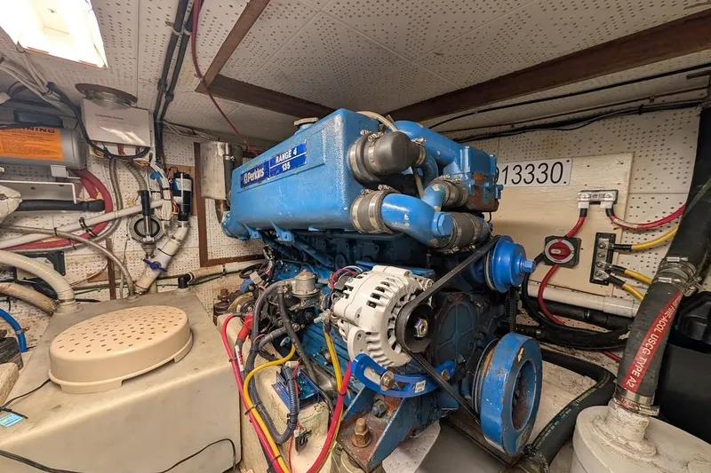 Slide: The Image of Engine room of a 1987 DeFever Trawler featuring a Perkins Range 4 135 engine. - 43