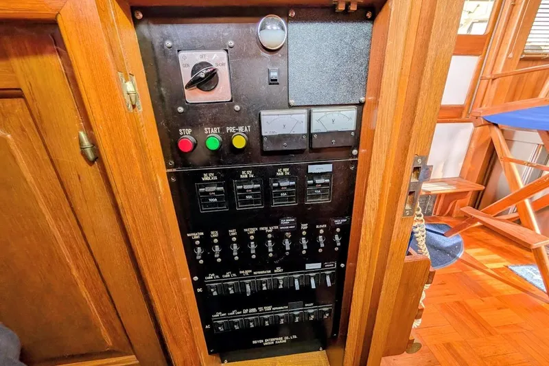Slide: The Image of Control panel of a 1987 DeFever Trawler with switches and gauges. - 9