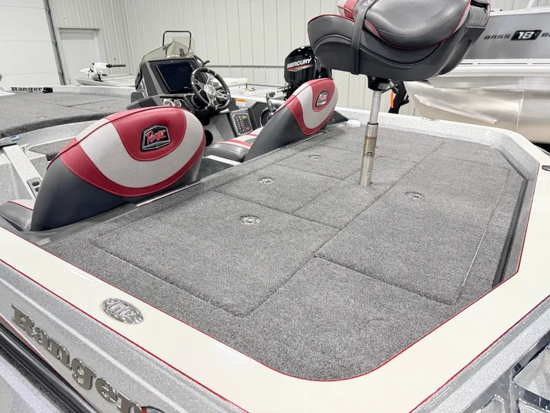 Slide: The Image of 2019 Ranger Z520L boat with gray carpet and red seats. - 24