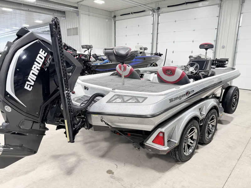 Slide: The Image of 2019 Ranger Z520L boat with Evinrude motor in garage. - 3