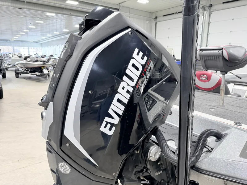 Slide: The Image of Evinrude motor on a 2019 Ranger Z520L boat in a storage facility. - 34
