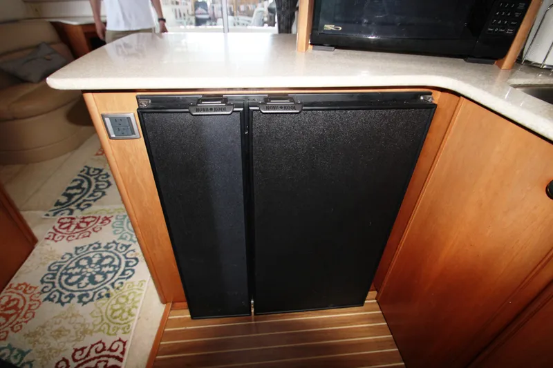 Slide: The Image of Kitchen area in a 2003 Meridian 381 Sedan yacht. - 15