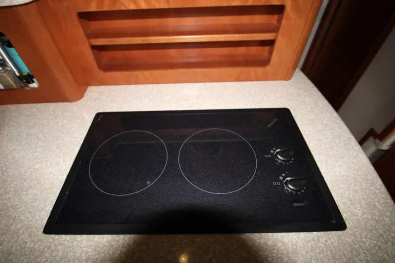 Slide: The Image of Cooktop in a 2003 Meridian 381 Sedan yacht. - 17