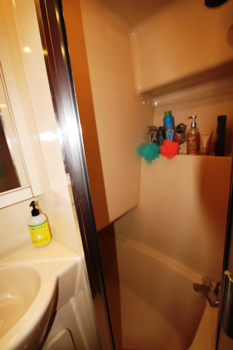 Slide: The Image of Bathroom in 2003 Meridian 381 Sedan with shower area and toiletries. - 39