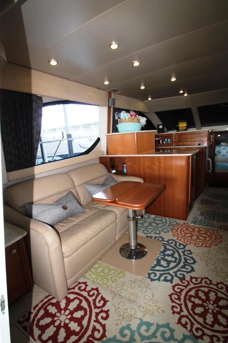 Slide: The Image of Interior of a 2003 Meridian 381 Sedan yacht with sofa and table. - 9