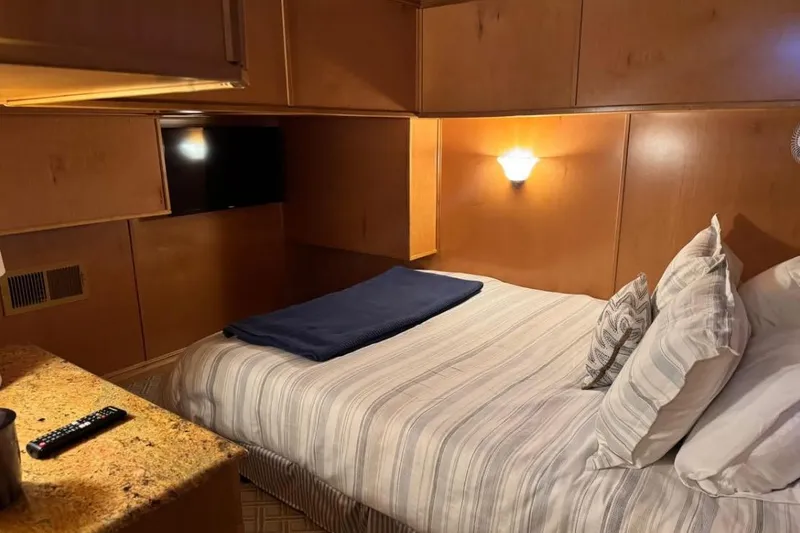 Slide: The Image of Cozy bedroom in 2009 Starlite 18 x 70 houseboat with TV and ambient lighting. - 11
