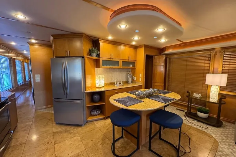 Slide: The Image of Luxurious kitchen interior of 2009 Starlite 18 x 70 houseboat with modern appliances and elegant decor. - 7
