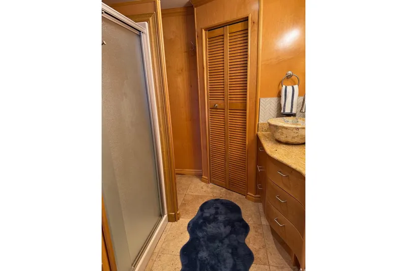 Slide: The Image of Bathroom interior of 2009 Starlite 18 x 70 Houseboat with wooden cabinets and shower. - 9