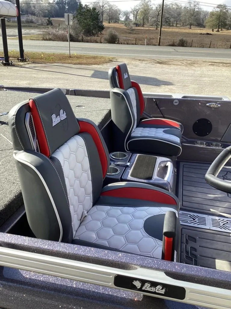 Slide: The Image of Close-up of Bass Cat Puma STS 2026 boat hull with sparkling finish. - 11