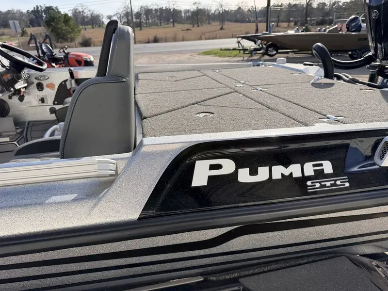 Slide: The Image of Interior of 2026 Bass Cat Puma STS with cup holders. - 35