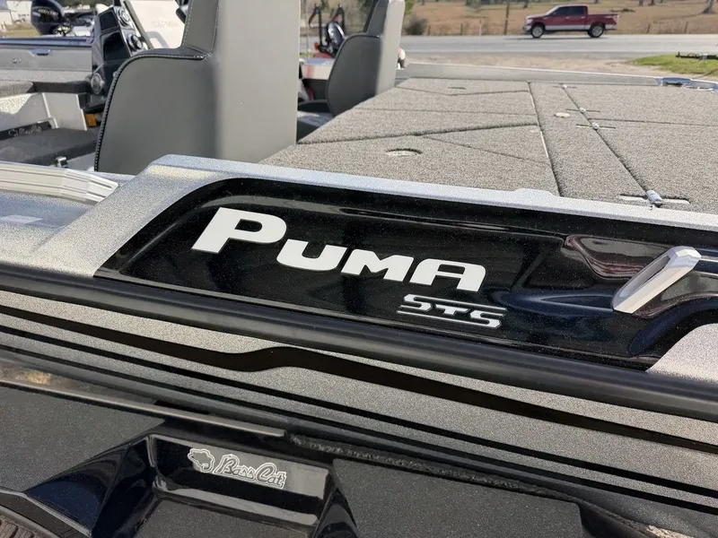 Slide: The Image of 2026 Bass Cat Puma STS boat seat with storage and cup holders. - 36