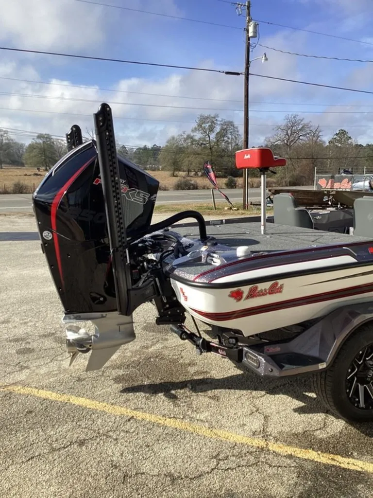 Slide: The Image of 2026 Bass Cat Puma STS boat with engine and US flag. - 4