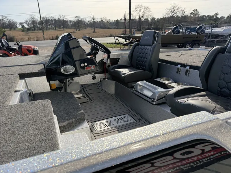 Slide: The Image of Interior of 2026 Bass Cat Puma STS with gray carpet and seating. - 40