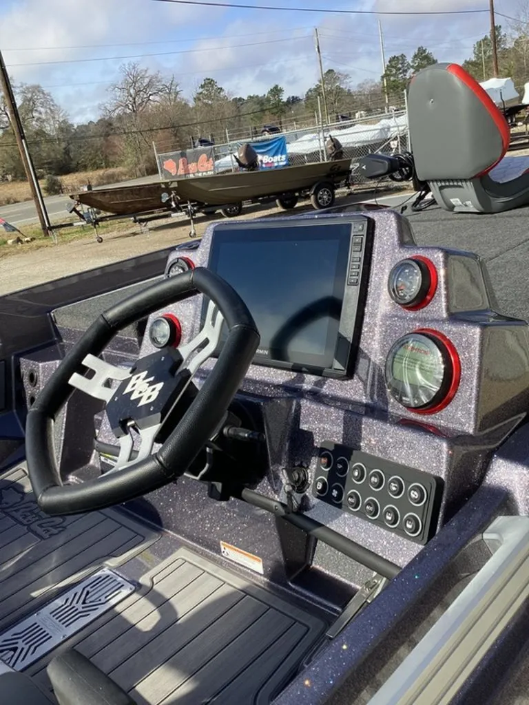 Slide: The Image of 2026 Bass Cat Puma STS boat on trailer outdoors. - 9