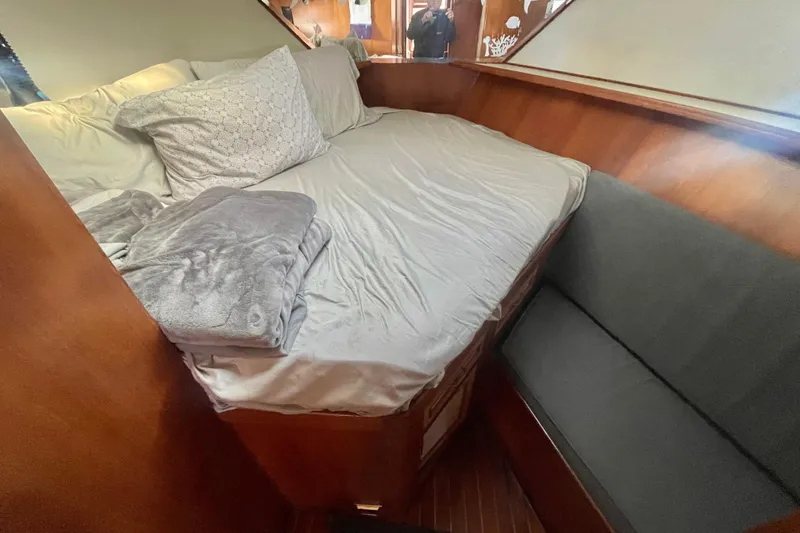 Slide: The Image of Cozy cabin interior of 1986 Hi-Star Aft Cabin yacht with bed and seating. - 34