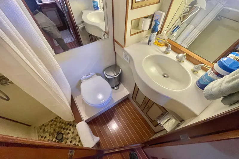 Slide: The Image of Compact bathroom in 1986 Hi-Star Aft Cabin yacht with sink, toilet, and shower. - 39