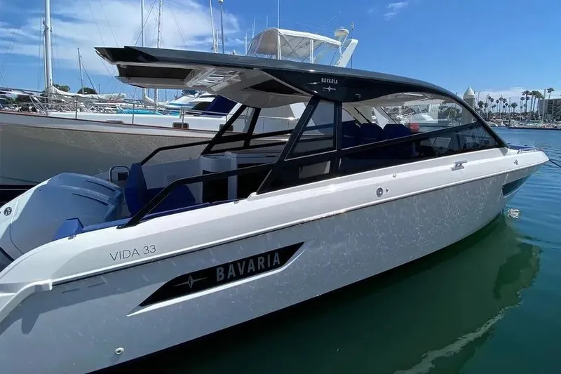 Slide: The Image of 2023 Bavaria Vida 33 boat docked in marina under clear blue sky. - 15