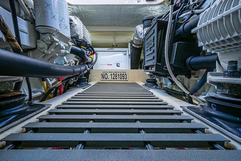 Slide: The Image of Engine room of a 2017 Tiara Yacht coupe, featuring Cummins Onan generator. - 15