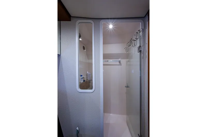 Slide: The Image of 2017 Tiara Yacht coupe bathroom with modern shower and sleek design. - 29