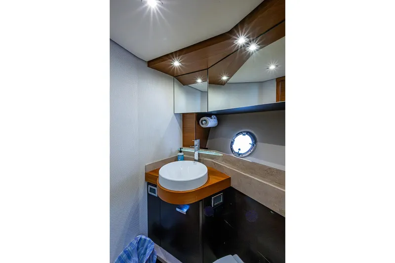 Slide: The Image of Luxurious bathroom interior of 2017 Tiara Yacht coupe with modern fixtures and porthole window. - 30