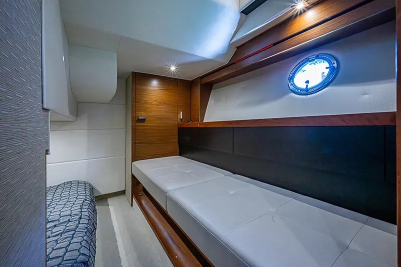 Slide: The Image of Luxurious interior cabin of a 2017 Tiara Yacht coupe, featuring modern design and cozy seating. - 31