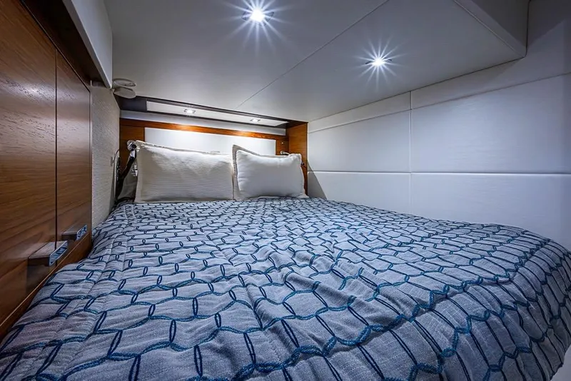 Slide: The Image of Luxurious 2017 Tiara Yacht coupe cabin with cozy bed and modern lighting. - 33
