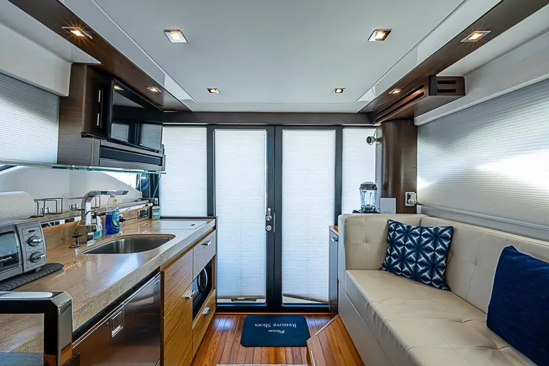 Slide: The Image of Luxurious interior of 2017 Tiara Yacht coupe with modern kitchen and seating area. - 42