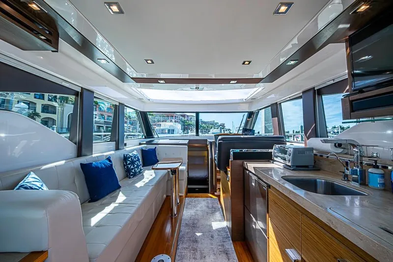 Slide: The Image of Luxurious interior of 2017 Tiara Yacht coupe with modern kitchen and seating area. - 51