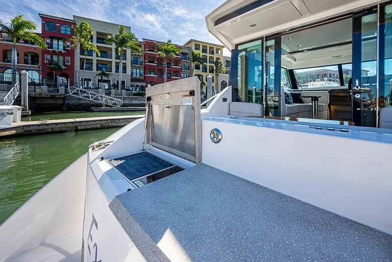 Slide: The Image of 2017 Tiara Yacht Coupe docked near colorful waterfront buildings. - 52