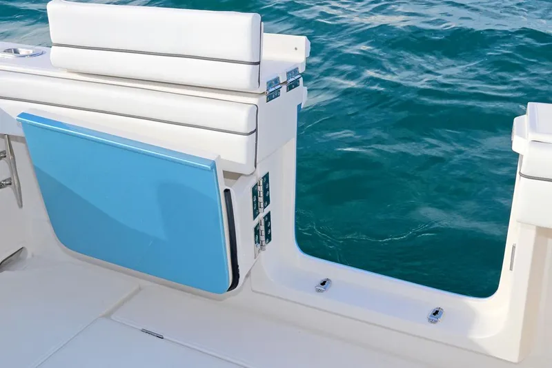 Slide: The Image of Manufacturer Provided Image: 2026 Jupiter 38 boat with open side door, white seating, and blue panel, on clear water. - 4