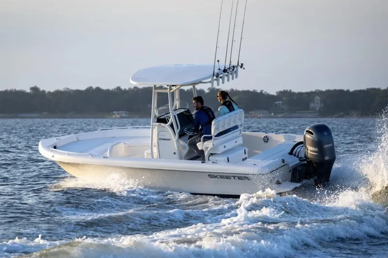Slide: The Image of Manufacturer Provided Image: 2026 Skeeter SX2350 boat cruising on open water with two passengers. - 10