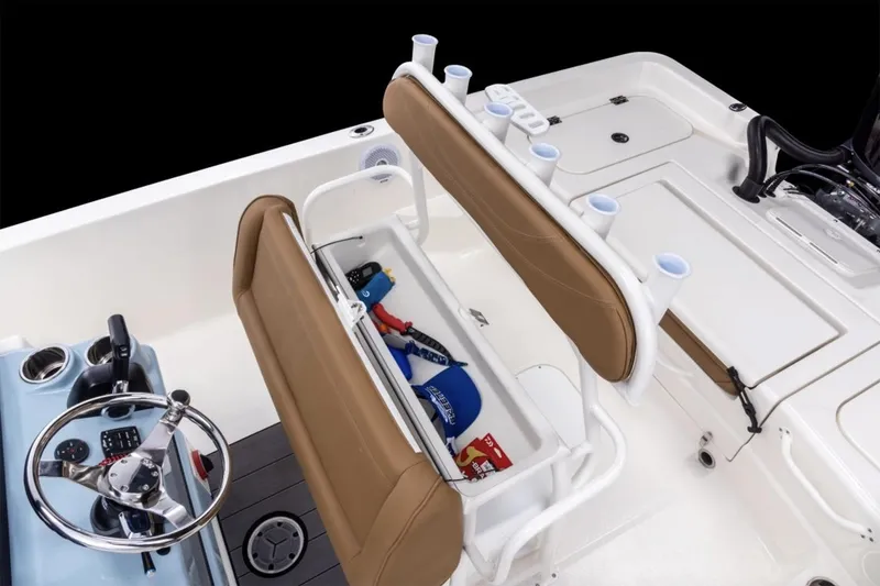 Slide: The Image of Manufacturer Provided Image: 2026 Skeeter SX2350 boat interior with storage, steering wheel, and cup holders. - 15