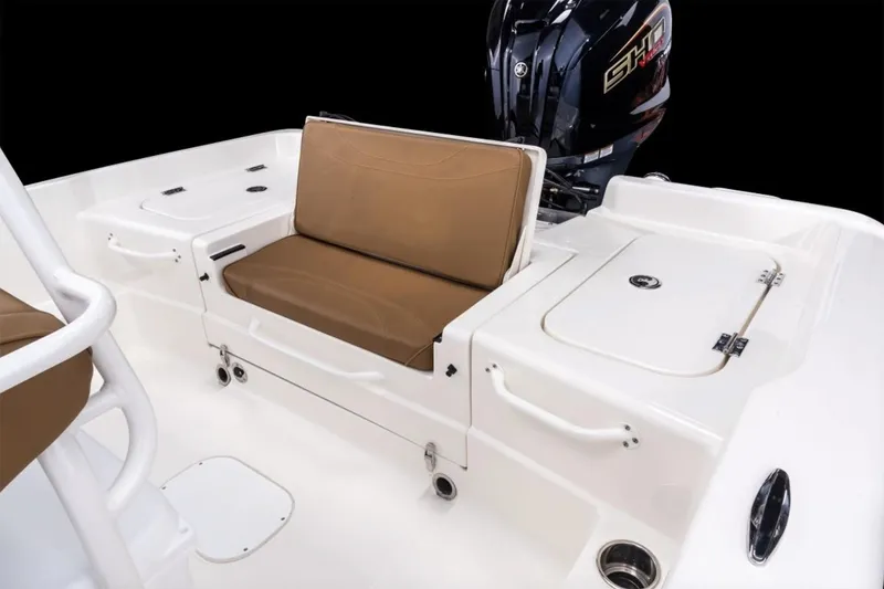 Slide: The Image of Manufacturer Provided Image: 2026 Skeeter SX2350 boat interior with brown seating and storage compartments. - 16