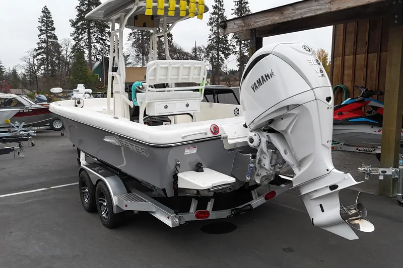 Slide: The Image of 2026 Skeeter SX2350 boat with Yamaha engine on trailer in outdoor setting. - 18