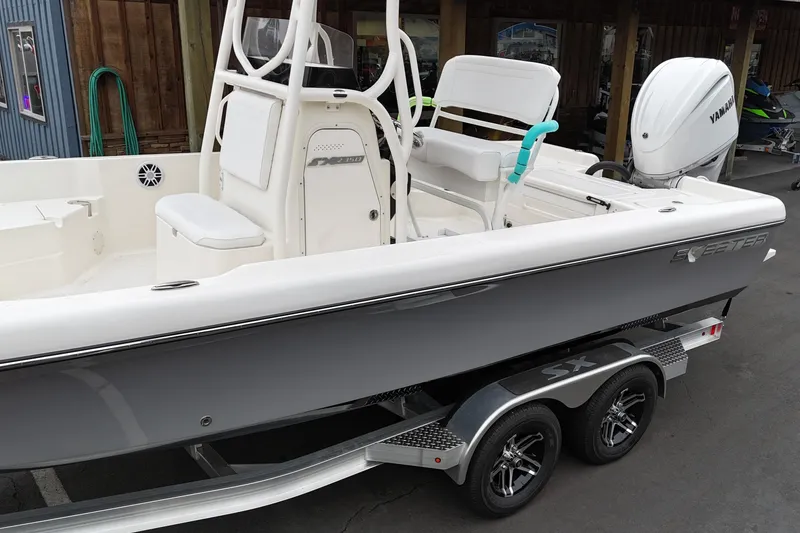 Slide: The Image of 2026 Skeeter SX2350 boat on trailer, featuring sleek design and Yamaha outboard motor. - 21