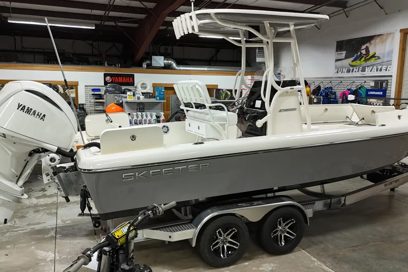 Slide: The Image of 2026 Skeeter SX2350 boat with Yamaha engine displayed in showroom. - 4