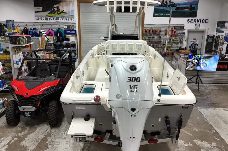 Slide: The Image of 2026 Skeeter SX2350 boat with powerful V6 engine displayed in a showroom. - 5