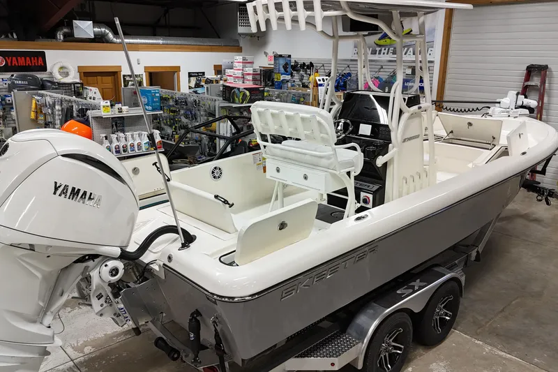 Slide: The Image of 2026 Skeeter SX2350 boat with Yamaha engine in a showroom setting. - 8
