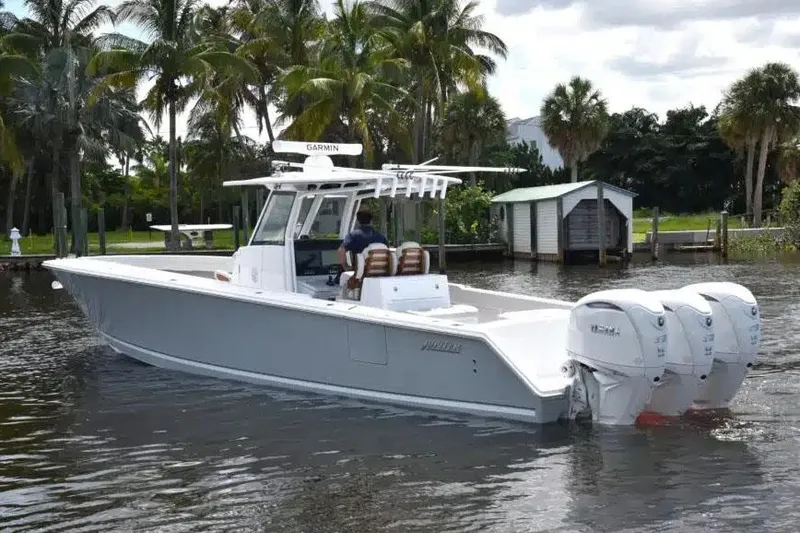 The Image of Manufacturer Provided Image: 2026 Jupiter 380LS boat cruising on a calm waterway with palm trees in the background. - 0