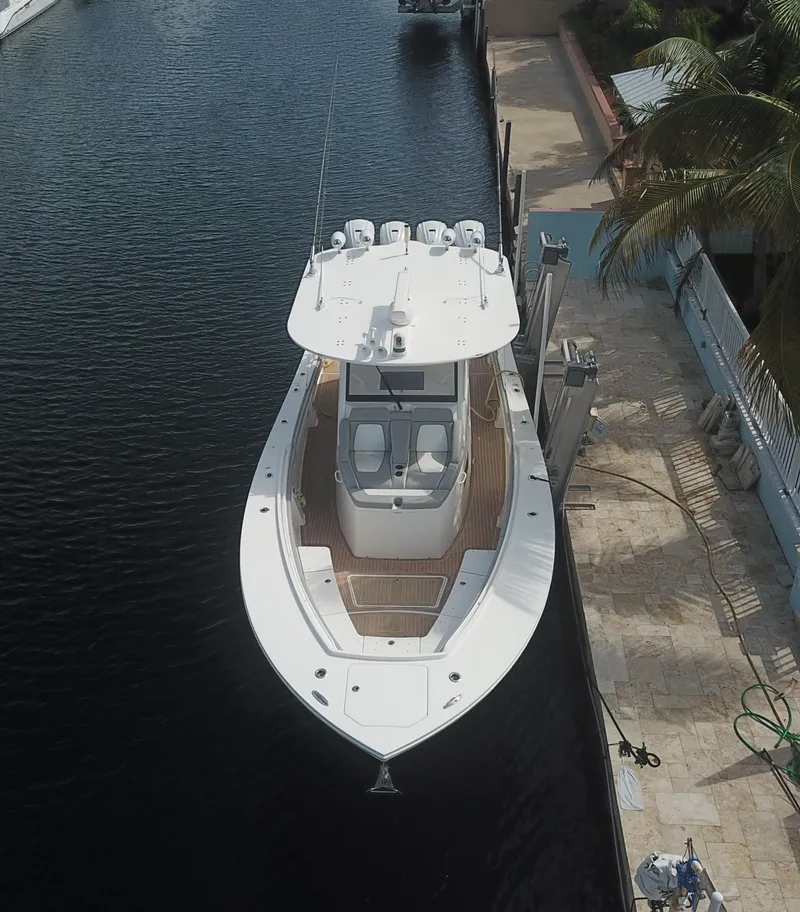 Slide: The Image of Aerial view of 2022 Regulator 41 boat docked by a canal. - 12