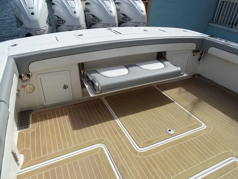 Slide: The Image of 2022 Regulator 41 boat deck with seating and outboard motors. - 17