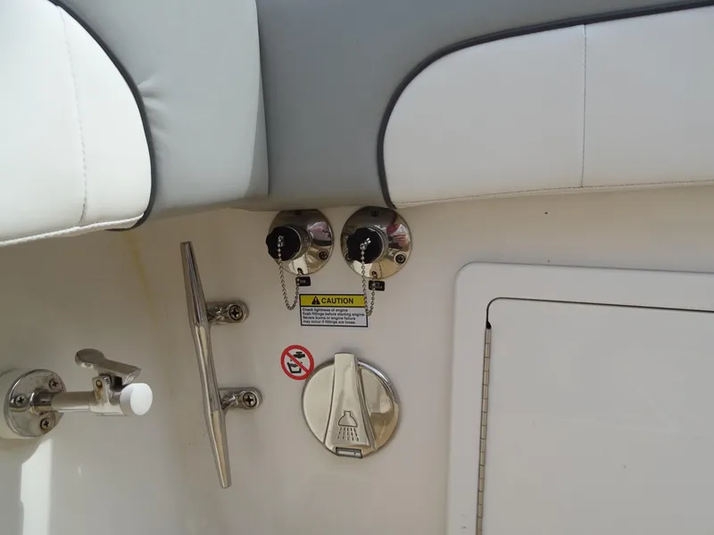 Slide: The Image of Regulator 41 boat controls and fittings, 2022 model, featuring safety labels and storage compartment. - 18