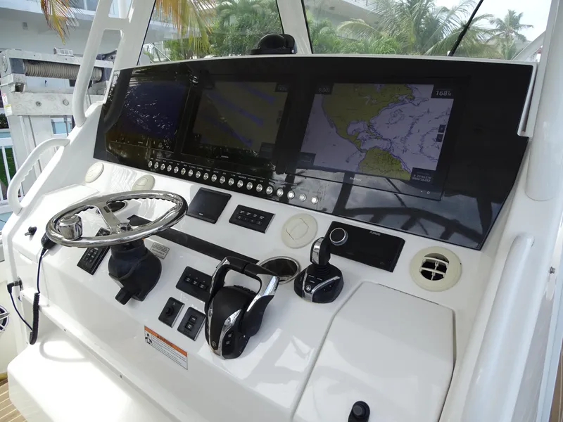 Slide: The Image of 2022 Regulator 41 boat dashboard with navigation screens and controls. - 24