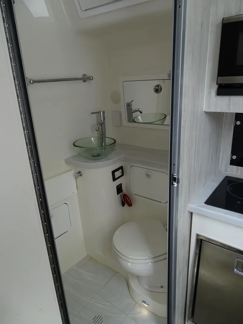 Slide: The Image of 2022 Regulator 41 boat bathroom with modern fixtures and compact design. - 36