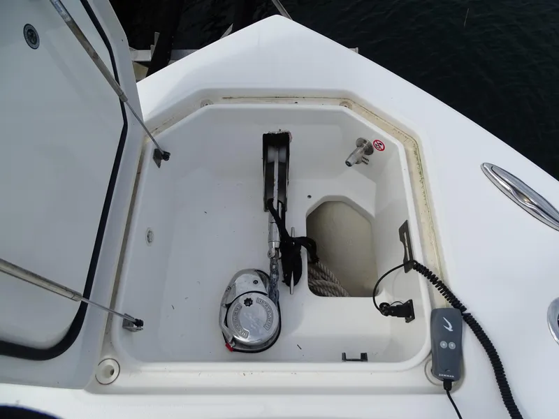 Slide: The Image of Anchor storage compartment on 2022 Regulator 41 boat, featuring winch and rope. - 41