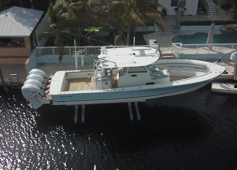Slide: The Image of 2022 Regulator 41 boat docked near waterfront property. - 8