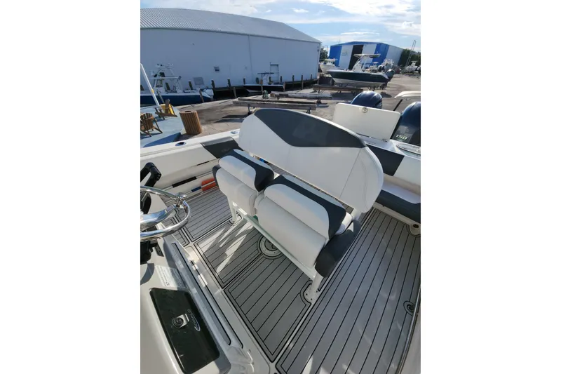Slide: The Image of 2019 Robalo R242 Center Console boat interior with seating and steering wheel. - 13