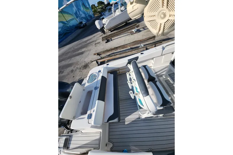 Slide: The Image of 2019 Robalo R242 Center Console boat interior with seating and storage compartments. - 9
