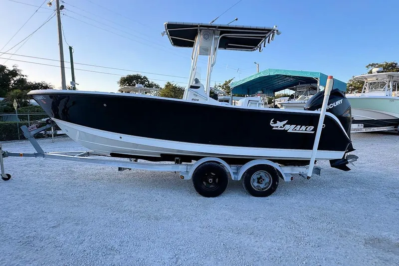 Slide: The Image of 2013 Mako 204 Center Console boat on trailer, parked outdoors. - 4